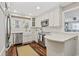 Bright, modern kitchen features stainless appliances, white cabinets and hardwood floors at 412 Middleton Dr., Pawleys Island, SC 29585