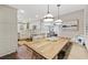Bright kitchen with a rustic wood table, white cabinetry, and modern appliances at 412 Middleton Dr., Pawleys Island, SC 29585