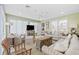 Spacious living room with neutral tones, ceiling fan, and a view to laundry room at 412 Middleton Dr., Pawleys Island, SC 29585