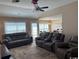 Spacious living room features comfortable seating, a ceiling fan, and neutral-toned walls at 429 Oakham Dr., Conway, SC 29526