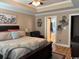 Spacious main bedroom features a trey ceiling, neutral paint, and a large bed with decorative pillows at 429 Oakham Dr., Conway, SC 29526