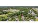 Aerial view of property, showcasing lush green trees and close proximity to a highway at 4450 Little River Inn Ln. # 601, Little River, SC 29566