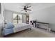 Comfortable bedroom featuring a neutral color scheme, a ceiling fan, and plenty of natural light at 4450 Little River Inn Ln. # 601, Little River, SC 29566