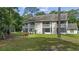 Charming multi-level condo features balconies and a beautiful yard with a picnic table at 4450 Little River Inn Ln. # 601, Little River, SC 29566