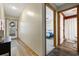 Inviting hallway leading to the bedroom and bathroom, features wood floors and a view of the front door at 4450 Little River Inn Ln. # 601, Little River, SC 29566
