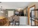Modern kitchen featuring dark cabinets, stainless steel appliances, and a breakfast bar with seating at 4450 Little River Inn Ln. # 601, Little River, SC 29566