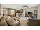 Open-concept living room with bar seating, dining area, comfortable sofas, and view into the kitchen at 4450 Little River Inn Ln. # 601, Little River, SC 29566