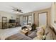 Well-decorated living room featuring a comfortable couch, flat-screen TV, and access to the outdoor patio at 4450 Little River Inn Ln. # 601, Little River, SC 29566