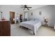 Bright bedroom with a ceiling fan, adjacent sitting area, and a walk-in closet for ample storage at 4450 Little River Inn Ln. # 601, Little River, SC 29566