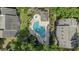 Aerial view of community pool and hot tub with lounge chairs and landscaping at 4450 Little River Inn Ln. # 601, Little River, SC 29566