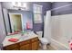Bathroom featuring a single sink vanity, toilet, and shower-tub combo at 4499 Firethorne Dr., Murrells Inlet, SC 29576