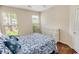 Charming bedroom with hardwood floors, a beach-themed bedspread, and natural light at 4499 Firethorne Dr., Murrells Inlet, SC 29576