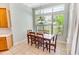 Cozy dining area with large window and a view to the green backyard at 4499 Firethorne Dr., Murrells Inlet, SC 29576