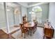 Elegant dining room with hardwood floors, a large window, and a beautiful chandelier at 4499 Firethorne Dr., Murrells Inlet, SC 29576