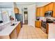 Well-equipped kitchen features stainless appliances, tiled floors, and plenty of counter space for meal preparation at 4499 Firethorne Dr., Murrells Inlet, SC 29576
