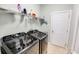 Laundry room with modern washer and dryer set and storage shelf at 4499 Firethorne Dr., Murrells Inlet, SC 29576