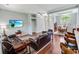Inviting living room features hardwood floors, stylish furniture, and seamless flow to dining area at 4499 Firethorne Dr., Murrells Inlet, SC 29576