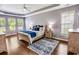 Spacious main bedroom with hardwood floors, tray ceiling, and natural light at 4499 Firethorne Dr., Murrells Inlet, SC 29576