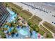 Beautiful aerial view of resort pools, beach, and oceanfront with plenty of amenities at 4800 S Ocean Blvd. # 1524, North Myrtle Beach, SC 29582