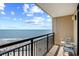 Condo balcony with a view of the beach, ocean, and blue sky at 4800 S Ocean Blvd. # 1524, North Myrtle Beach, SC 29582