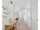 Long hallway with art decor, tile floors and recessed lighting to the main bedroom at 4800 S Ocean Blvd. # 1524, North Myrtle Beach, SC 29582