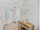 Welcoming foyer with wooden console table, beach-themed decor, and tile flooring at 4800 S Ocean Blvd. # 1524, North Myrtle Beach, SC 29582