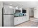 Compact kitchen with stainless steel appliances, granite countertops and blue subway tile backsplash at 4800 S Ocean Blvd. # 1524, North Myrtle Beach, SC 29582