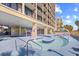 Inviting lazy river pool area with colorful play structures and a nearby high-rise building at 4800 S Ocean Blvd. # 1524, North Myrtle Beach, SC 29582