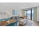 Bright living space with ocean views features comfortable seating and dining, creating an inviting coastal atmosphere at 4800 S Ocean Blvd. # 1524, North Myrtle Beach, SC 29582