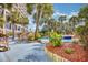 Lush landscaping surrounds a peaceful pool area with a wooden staircase and walkway at 4800 S Ocean Blvd. # 1524, North Myrtle Beach, SC 29582