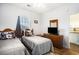 Twin beds, a wood dresser, and a window are featured in this bedroom at 4868 Dahlia Ct. # 202, Myrtle Beach, SC 29577