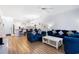 Living room seamlessly connects to the kitchen featuring hardwood floors and comfortable seating at 4868 Dahlia Ct. # 202, Myrtle Beach, SC 29577