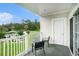 This patio features two chairs and an overlooking view of the community at 4868 Dahlia Ct. # 202, Myrtle Beach, SC 29577