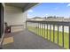 A spacious outdoor balcony with a view of the manicured lawn at 500 Fairway Village Dr. # J-7, Myrtle Beach, SC 29588