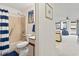 Bathroom with combined shower and tub with tiled walls and blue-striped shower curtain at 500 Fairway Village Dr. # J-7, Myrtle Beach, SC 29588