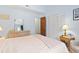 Bedroom featuring a large window, vaulted ceilings, and closet with shutter doors at 500 Fairway Village Dr. # J-7, Myrtle Beach, SC 29588