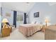 Bedroom with vaulted ceiling, blue walls, window, and light-colored carpet at 500 Fairway Village Dr. # J-7, Myrtle Beach, SC 29588