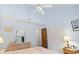Bedroom featuring a large window, vaulted ceilings, and closet with shutter doors at 500 Fairway Village Dr. # J-7, Myrtle Beach, SC 29588