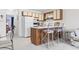 Compact kitchen with white cabinets, peninsula seating, and essential appliances at 500 Fairway Village Dr. # J-7, Myrtle Beach, SC 29588