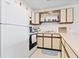 Clean kitchen featuring tile flooring and white appliances at 500 Fairway Village Dr. # J-7, Myrtle Beach, SC 29588