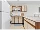 Bright kitchen with white appliances and lots of storage at 500 Fairway Village Dr. # J-7, Myrtle Beach, SC 29588