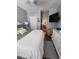 Comfortable bedroom with gray walls, an accent wall, a mounted television and ensuite bathroom at 503 20Th Ave. N # 3B, North Myrtle Beach, SC 29582