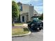 Charming condo with a well-manicured lawn and a stylish golf cart parked in the driveway at 503 20Th Ave. N # 3B, North Myrtle Beach, SC 29582