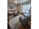 Living room featuring a futon sofa, glass-topped coffee table, and a leather recliner at 503 20Th Ave. N # 3B, North Myrtle Beach, SC 29582