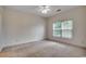This bedroom features carpeted floors, a window and a ceiling fan at 5046 Belleglen Court # 202, Myrtle Beach, SC 29579