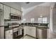 Open kitchen featuring stainless steel appliances, ample counter space, and a modern design at 5046 Belleglen Court # 202, Myrtle Beach, SC 29579