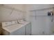 Practical laundry area featuring a washer, dryer, and wire shelving for storage at 5046 Belleglen Court # 202, Myrtle Beach, SC 29579