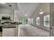 Open-concept space with a kitchen view and a view of a balcony from the living room at 5046 Belleglen Court # 202, Myrtle Beach, SC 29579