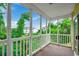 A screened in patio with beautiful views of the property's landscaping at 5046 Belleglen Court # 202, Myrtle Beach, SC 29579