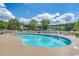 Community pool with chairs and picnic tables at 5046 Belleglen Court # 202, Myrtle Beach, SC 29579